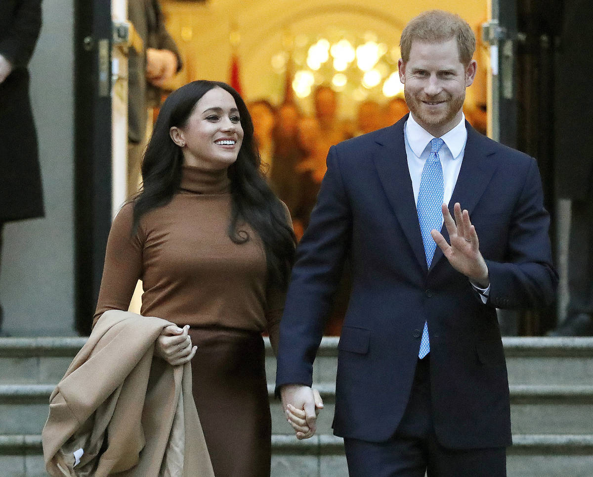 FILE - Prince Harry and Meghan, the Duke and Duchess of Sussex, leave after visiting Canada Hou ...