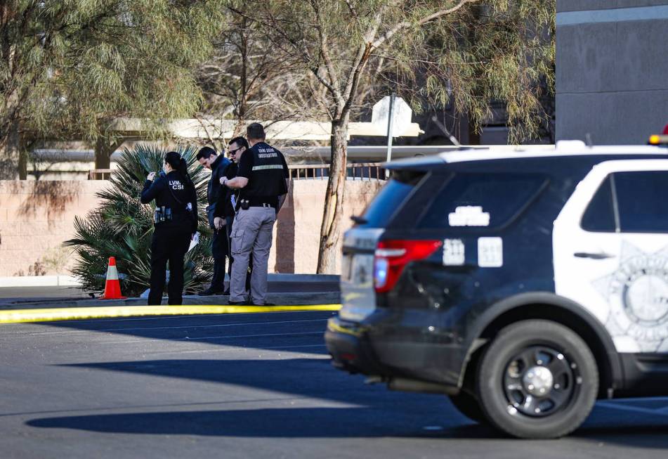 Police investigate the scene of a homicide on the 3900 block of West Cheyenne Avenue on Tuesday ...