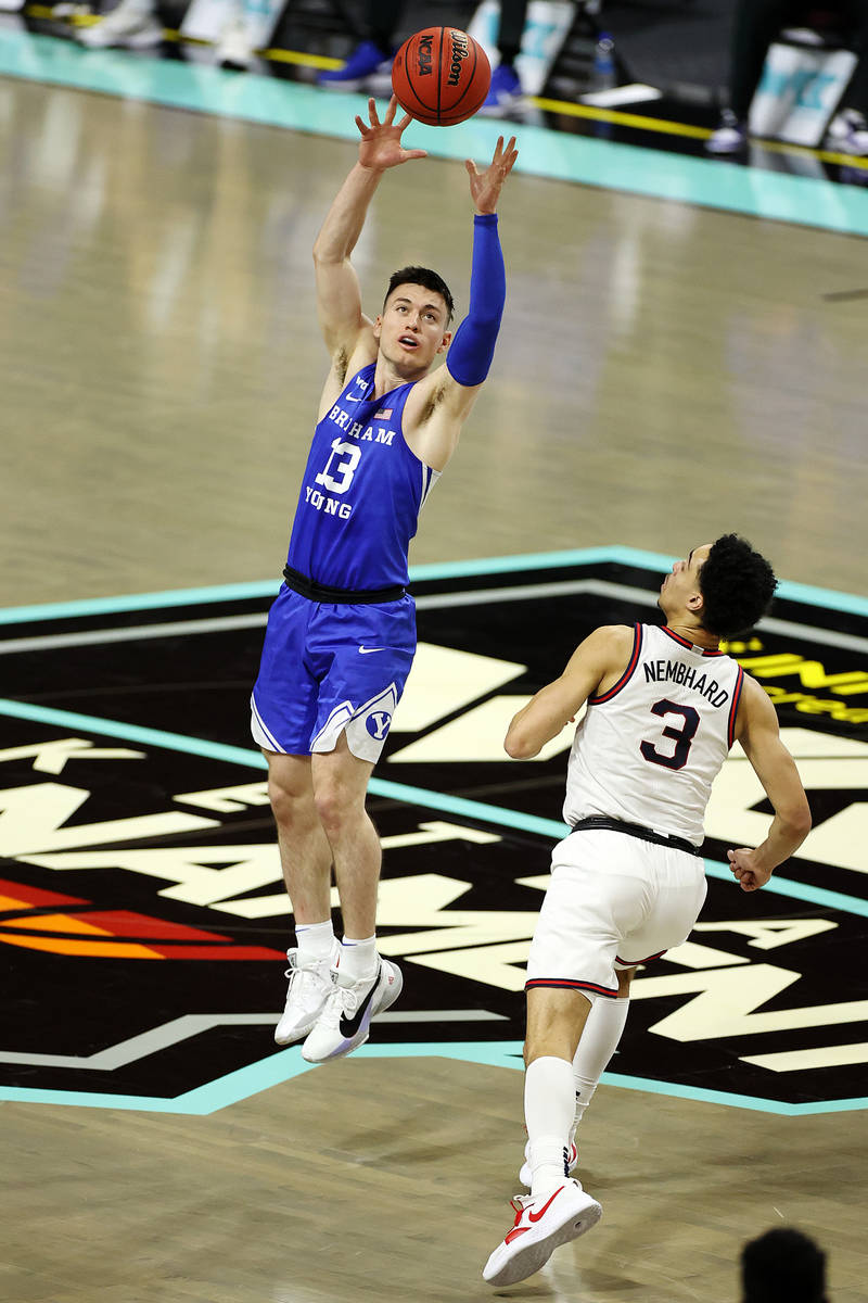 Brigham Young Cougars guard Alex Barcello (13) catches a high pass under pressure from Gonzaga ...