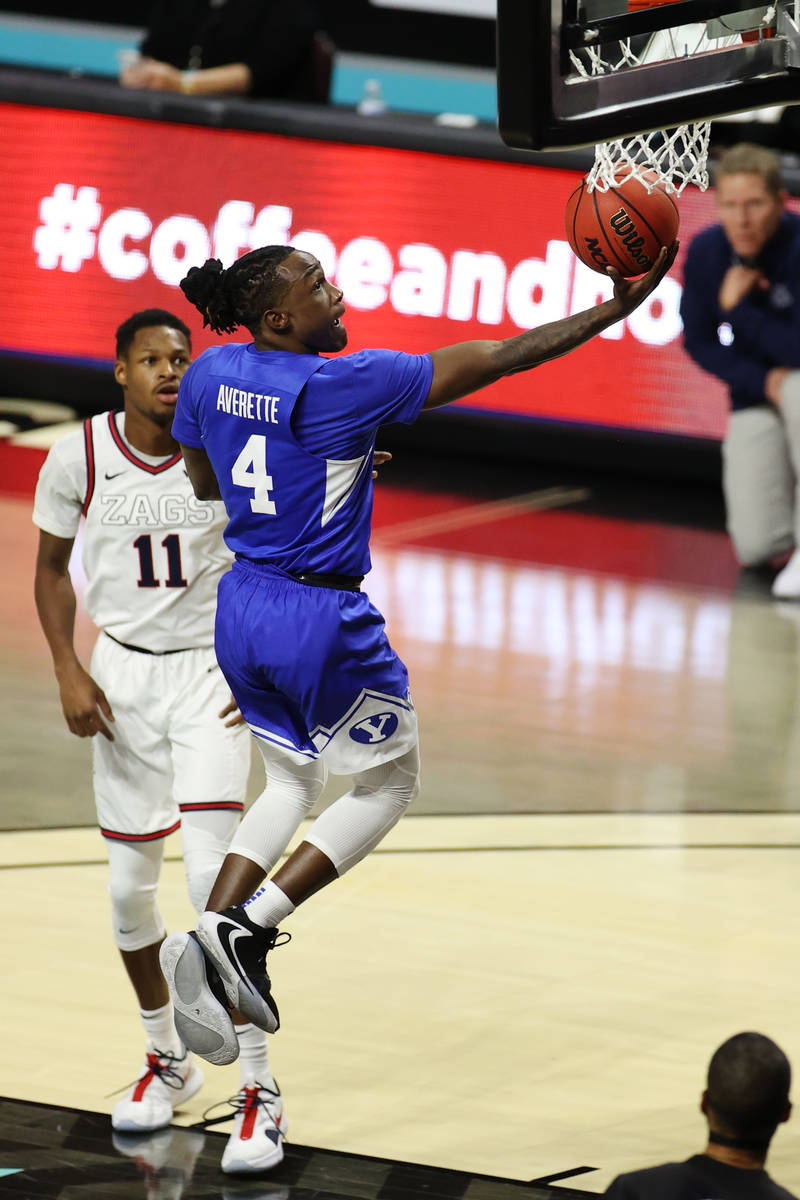 Brigham Young Cougars guard Brandon Averette (4) goes up for a shot and a score against Gonzaga ...