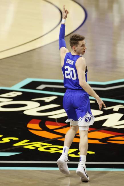 Brigham Young Cougars guard Spencer Johnson (20) raises his hand after scoring a three-point-sh ...