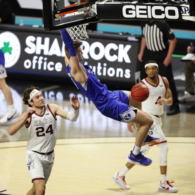 Brigham Young Cougars forward Matt Haarms (3) dunks the ball as Gonzaga Bulldogs forward Corey ...