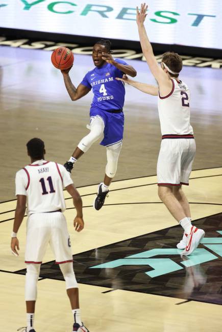 Brigham Young Cougars guard Brandon Averette (4) gets ready to pass the ball under pressure fro ...