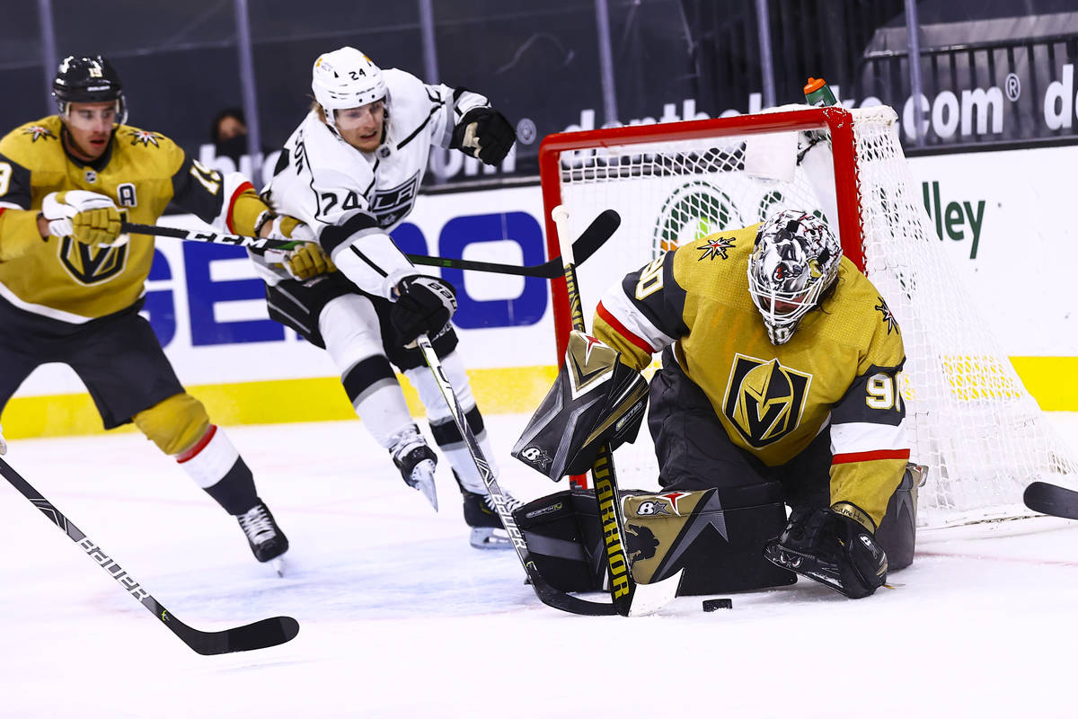 Golden Knights goaltender Robin Lehner (90) stops the puck against Los Angeles Kings center Lia ...