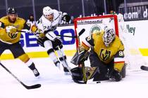 Golden Knights goaltender Robin Lehner (90) stops the puck against Los Angeles Kings center Lia ...