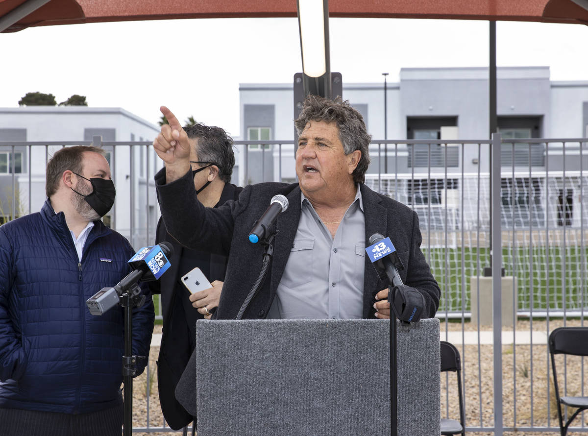 Chi Chi Bengochea, developer of the Showboat Park apartment complex, speaks prior to a ribbon-c ...