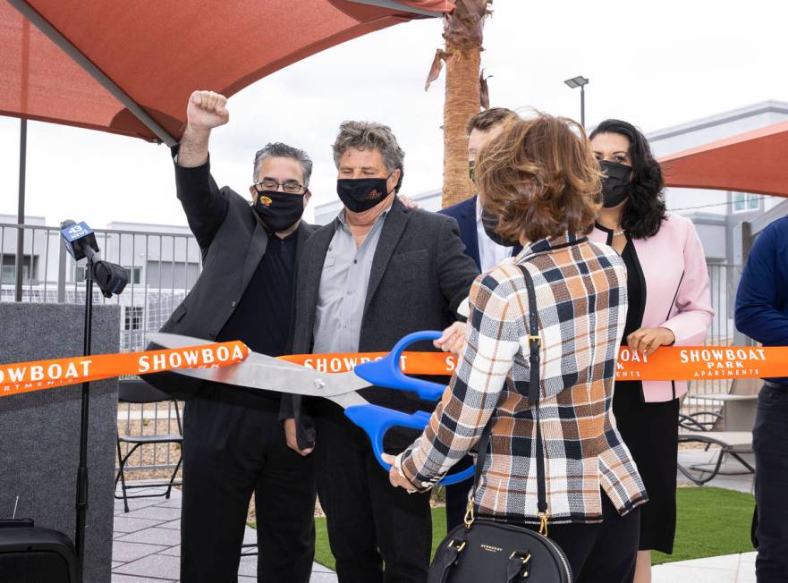 Peter Guzman, left, president of the Las Vegas Latin Chamber of Commerce, reacts as Dorothy Ben ...