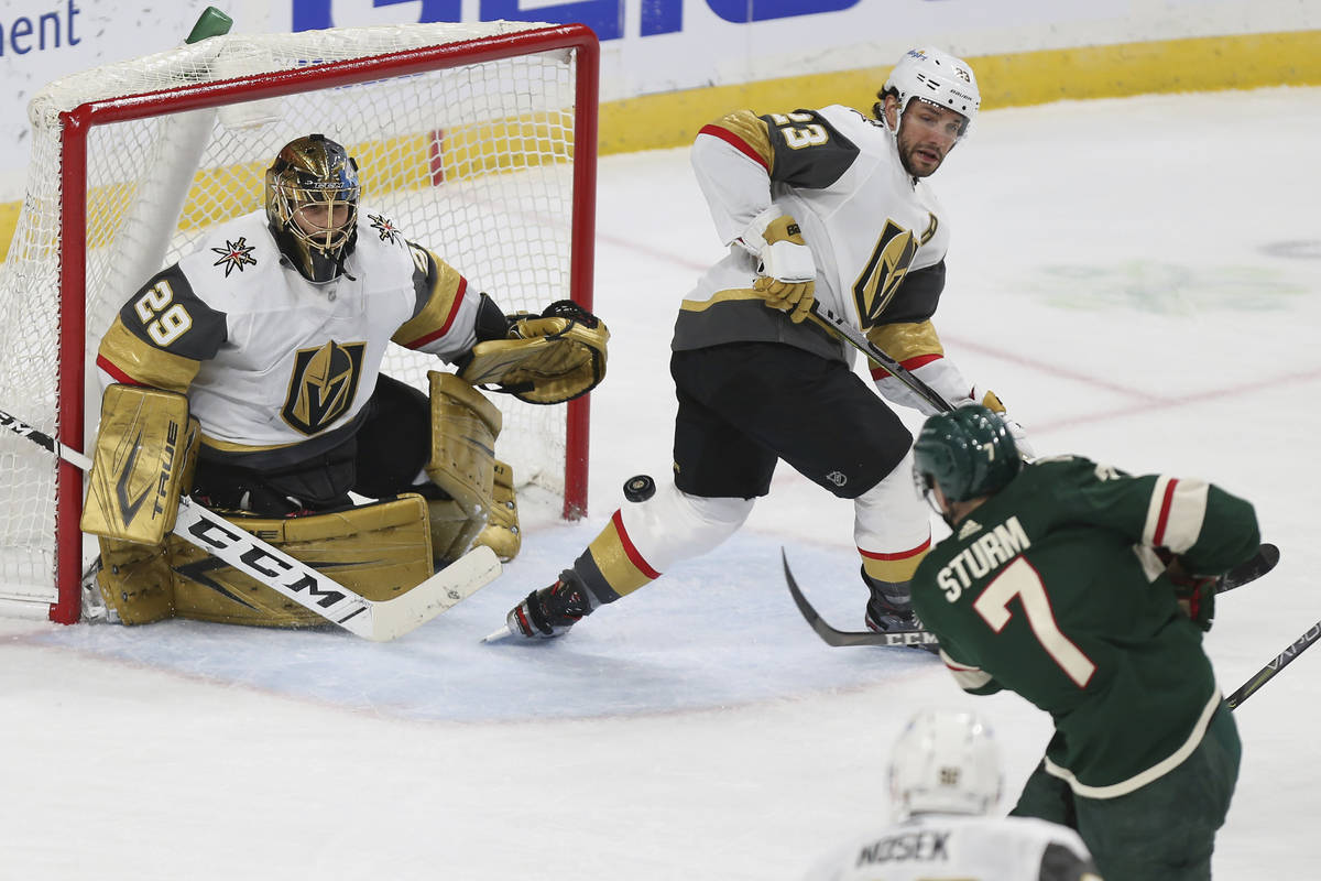Vegas Golden Knights goalie Marc-Andre Fleury (29) watches the puck shot by Minnesota Wild's Ni ...