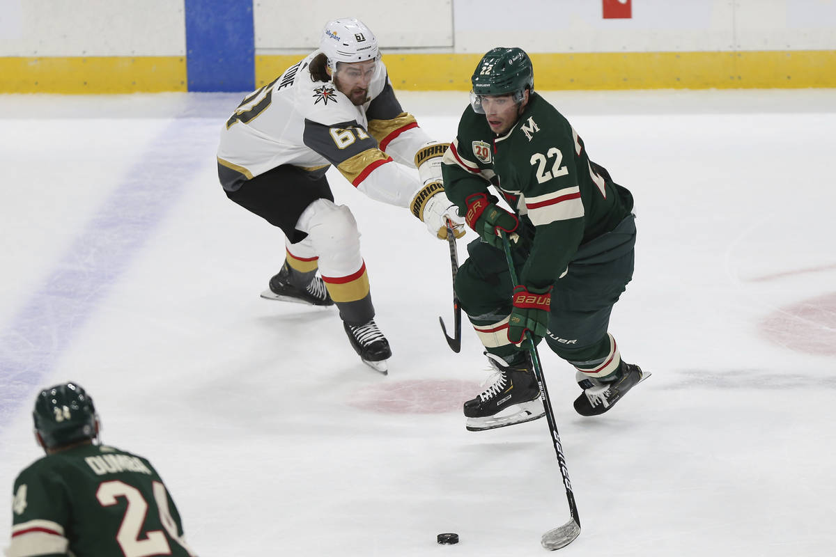 Minnesota Wild's Kevin Fiala (22) tries to maintain control of the puck against Vegas Golden Kn ...
