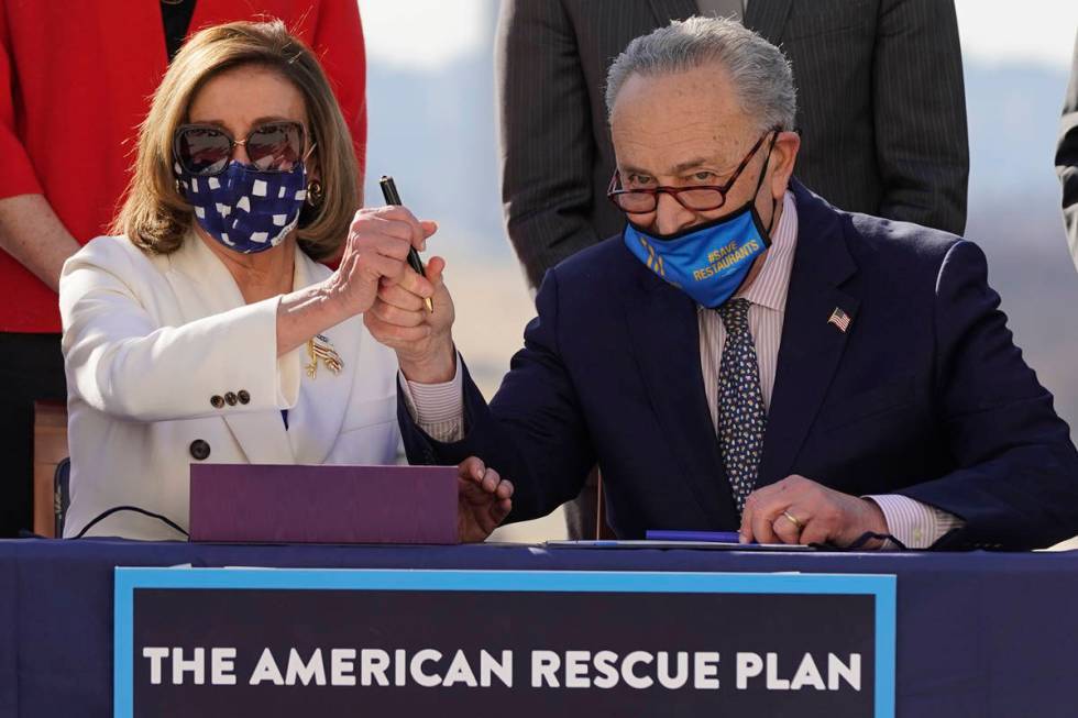 House Speaker Nancy Pelosi of Calif., and Senate Majority Leader Chuck Schumer of N.Y., pose af ...