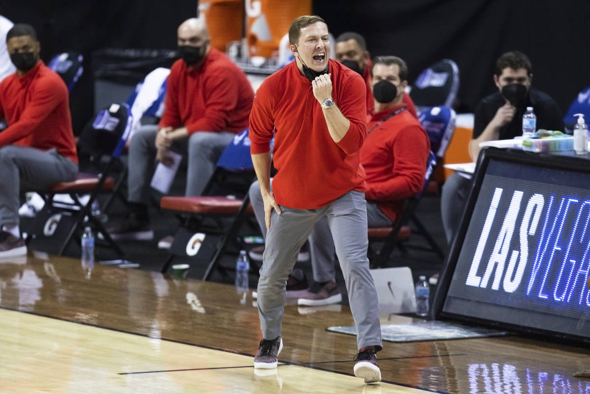 UNLV Rebels head coach T.J. Otzelberger directs his offense in the first half during the openin ...