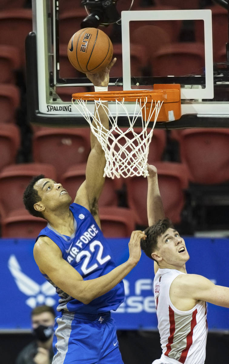 Air Force Falcons forward Nikc Jackson (22) drives past UNLV Rebels guard Caleb Grill (3) in th ...