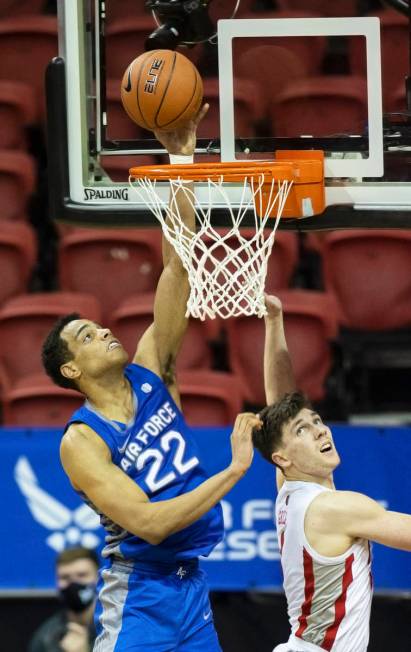 Air Force Falcons forward Nikc Jackson (22) drives past UNLV Rebels guard Caleb Grill (3) in th ...