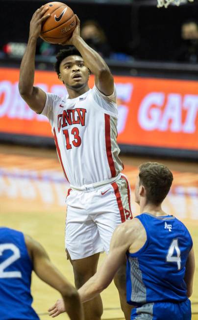 UNLV Rebels guard Bryce Hamilton (13) shoots over Air Force Falcons guard Carter Murphy (4) in ...