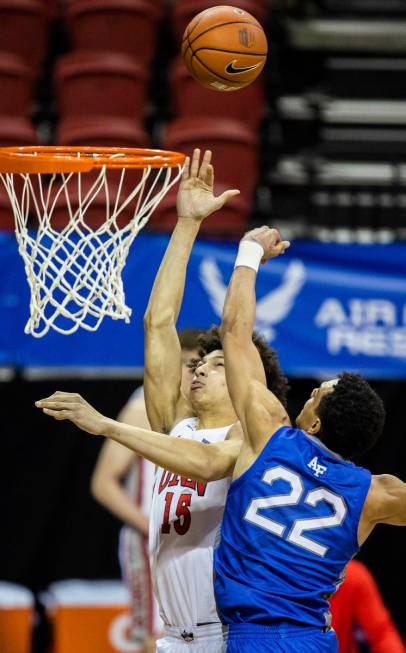 UNLV Rebels forward Reece Brown (15) drives past Air Force Falcons forward Nikc Jackson (22) in ...