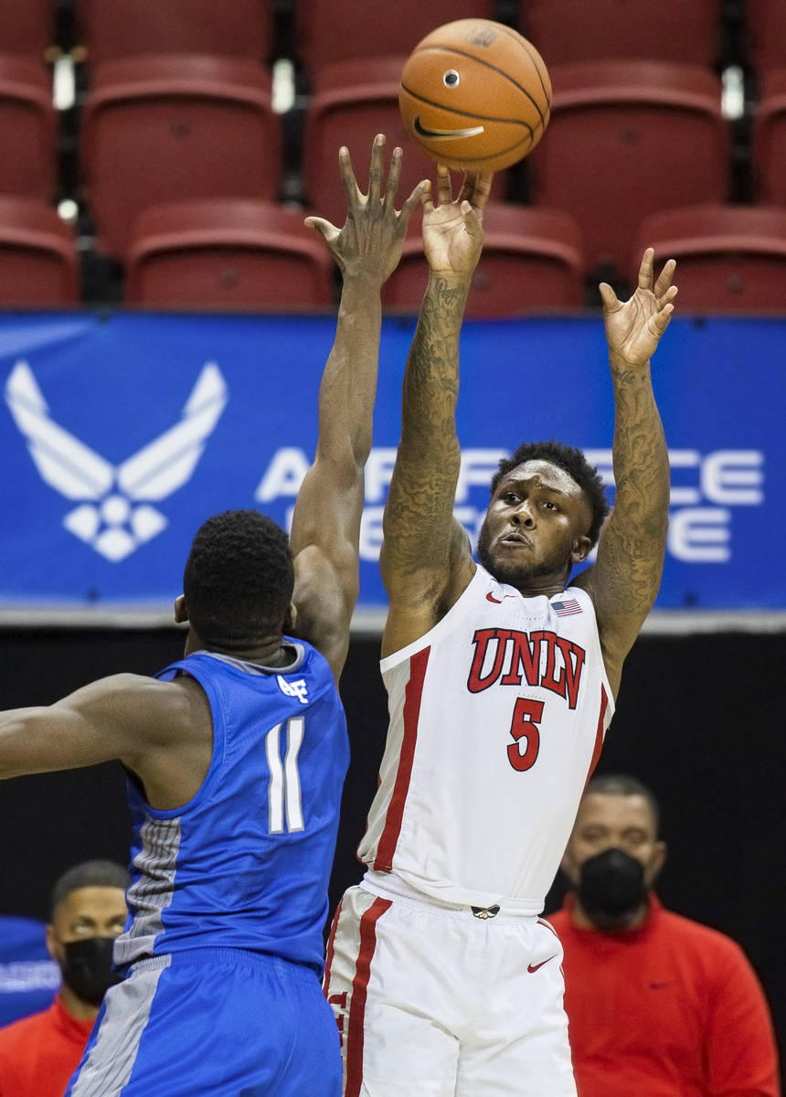 UNLV Rebels guard David Jenkins Jr. (5) shoots a corner three over Air Force Falcons guard Amek ...