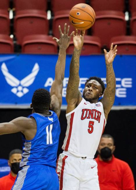 UNLV Rebels guard David Jenkins Jr. (5) shoots a corner three over Air Force Falcons guard Amek ...