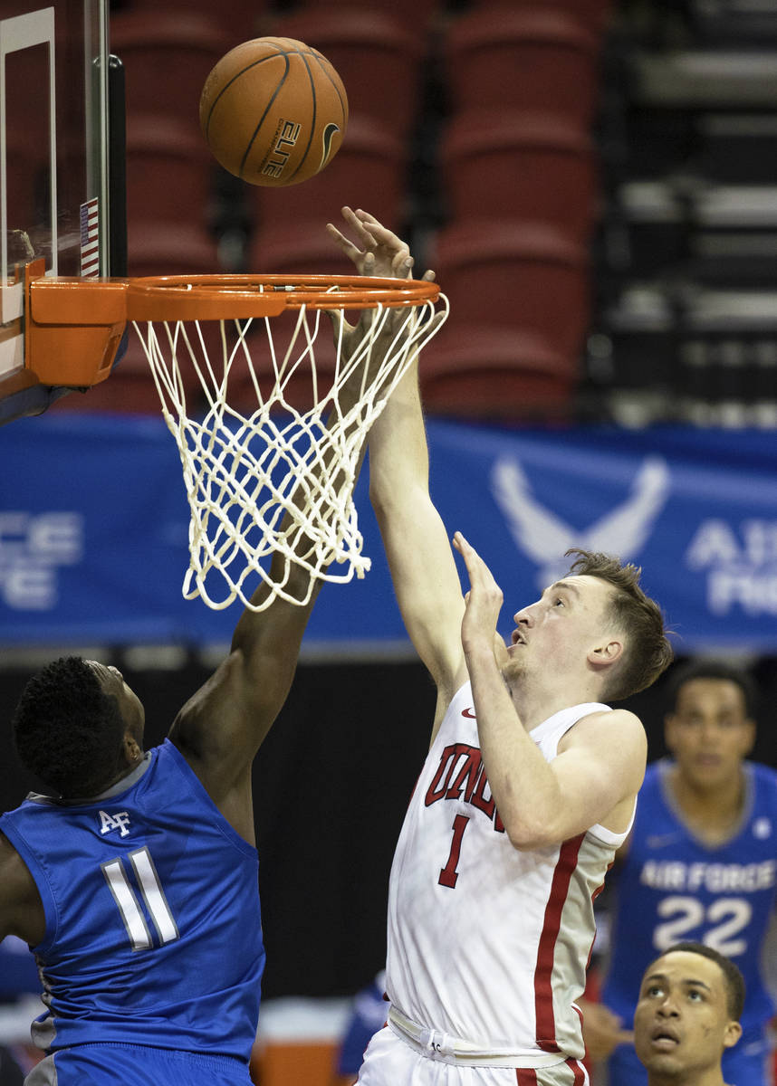 UNLV Rebels forward Moses Wood (1) shoots over Air Force Falcons guard Ameka Akaya (11) in the ...