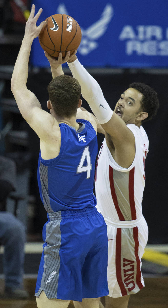 UNLV Rebels forward Devin Tillis (30) extends to block the shot of Air Force Falcons guard Cart ...