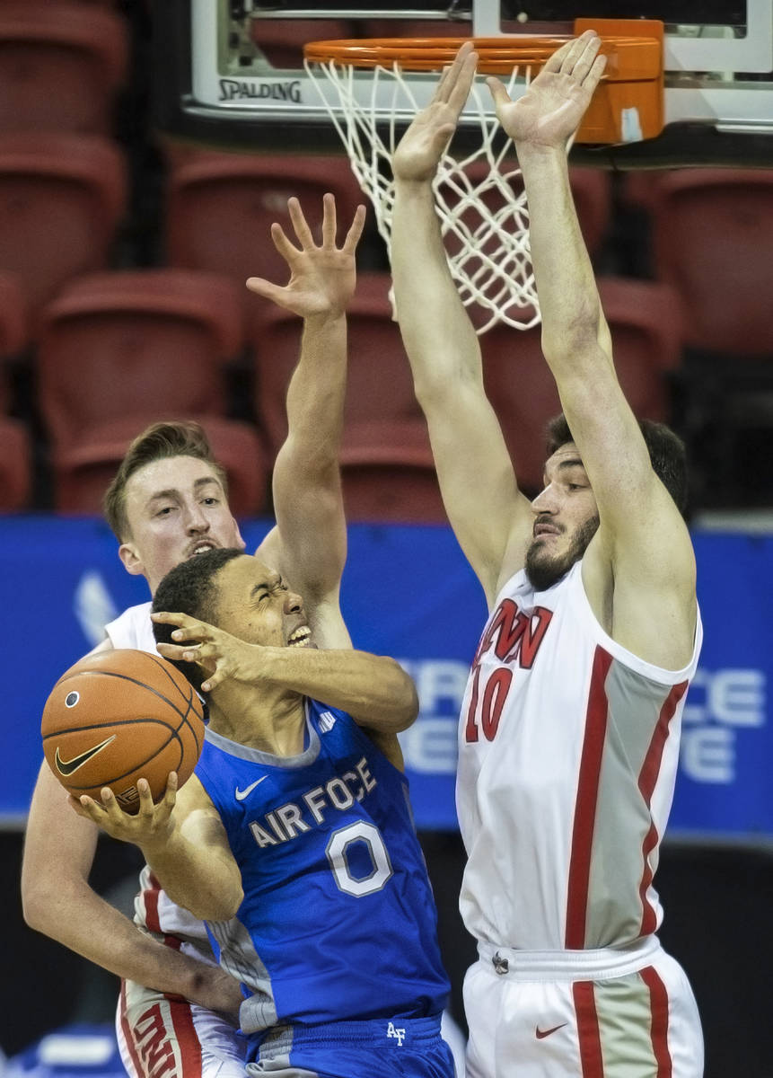 Air Force Falcons guard Joseph Octave (0) drives past UNLV Rebels forward Edoardo Del Cadia (10 ...