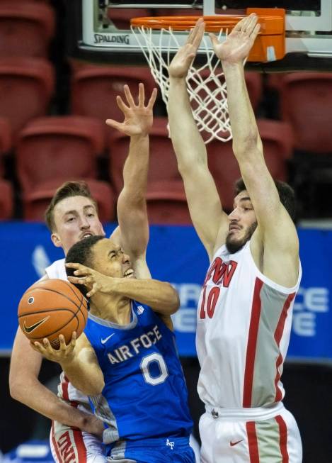 Air Force Falcons guard Joseph Octave (0) drives past UNLV Rebels forward Edoardo Del Cadia (10 ...