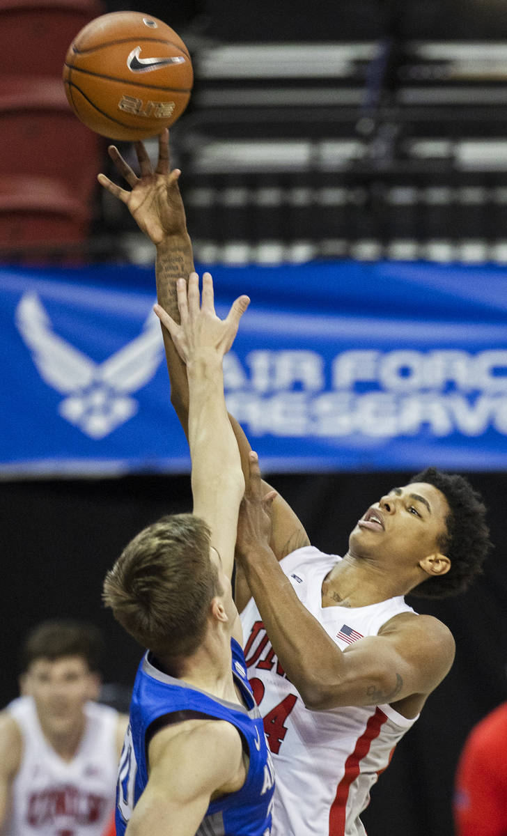 UNLV Rebels forward Kendrick Gilbert (24) shoots over Air Force Falcons guard Camden Vander Zwa ...