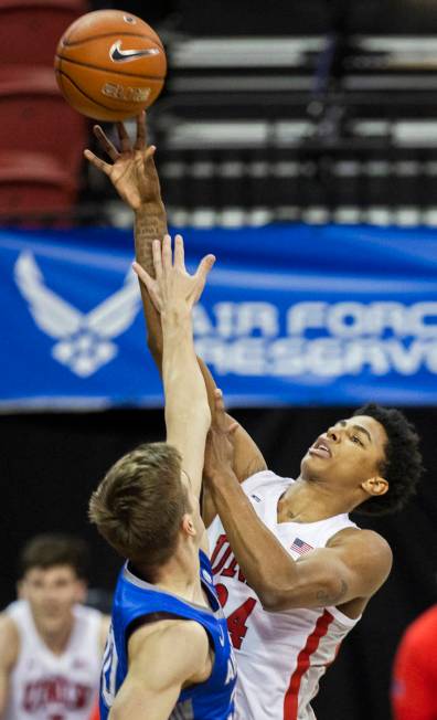 UNLV Rebels forward Kendrick Gilbert (24) shoots over Air Force Falcons guard Camden Vander Zwa ...