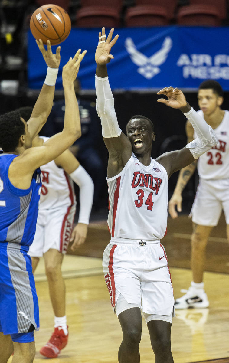 UNLV Rebels forward Cheikh Mbacke Diong (34) contests the shot of Air Force Falcons forward Nik ...