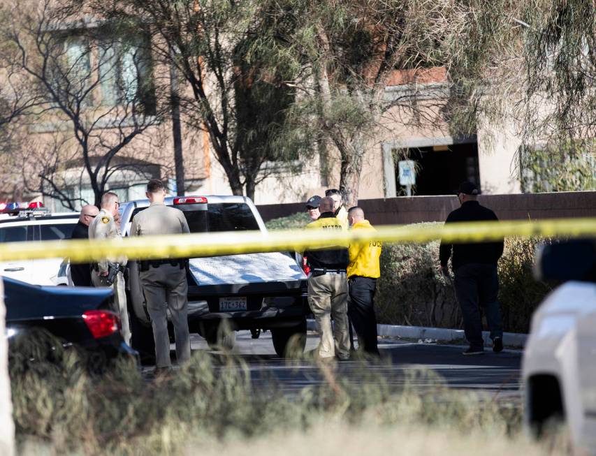 Police investigate the scene of a homicide on the 3900 block of West Cheyenne Avenue on Tuesday ...