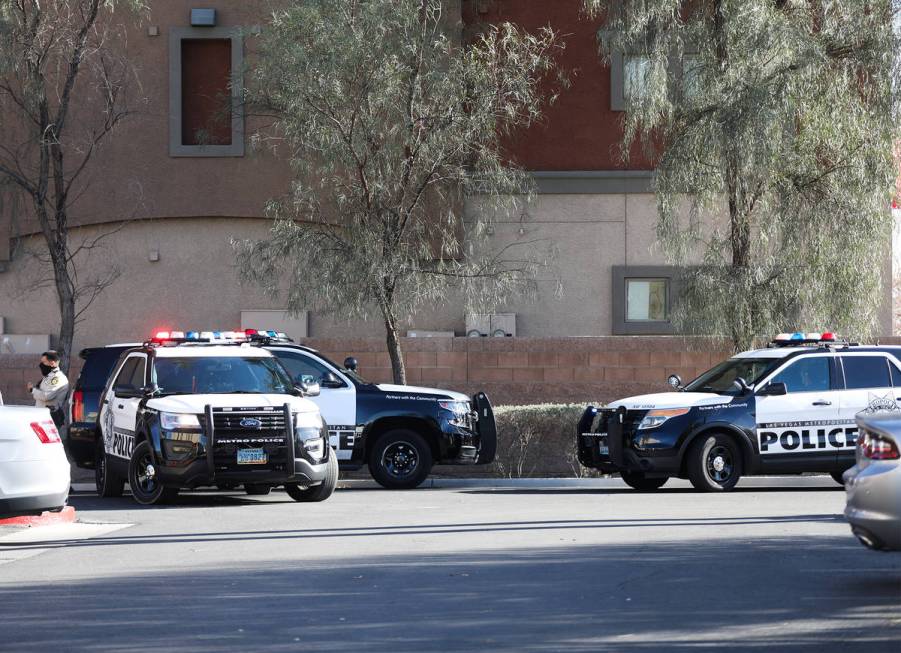 Police investigate the scene of a homicide on the 3900 block of West Cheyenne Avenue on Tuesday ...