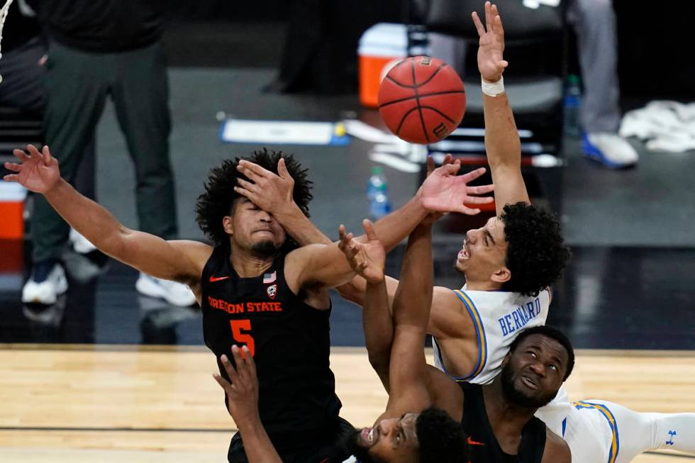 Oregon State's Ethan Thompson, clockwise from top left, UCLA's Jules Bernard, Oregon State's Ro ...