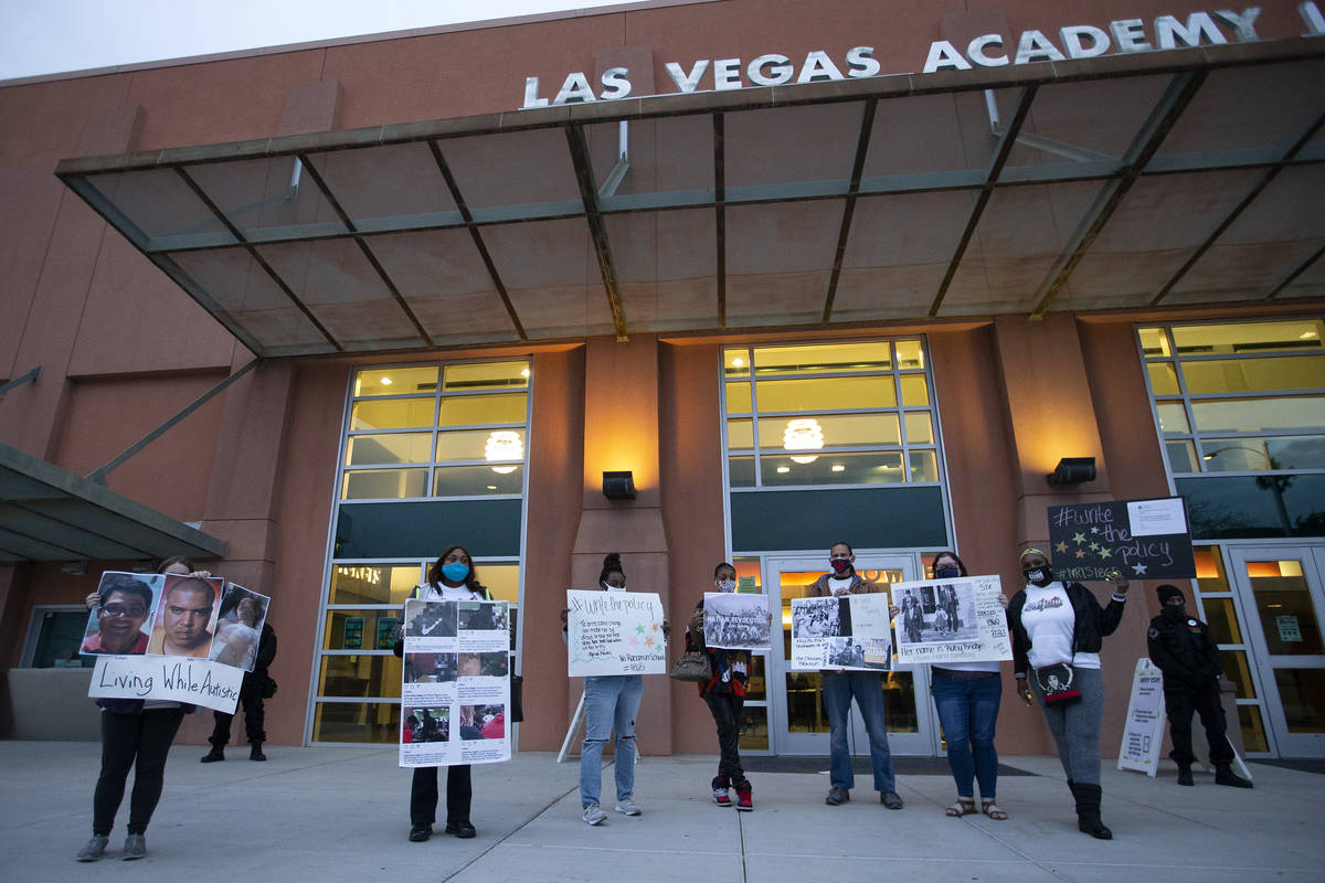 Protesters with No Racism in Schools #1865 silently demonstrate during a Clark County School Di ...
