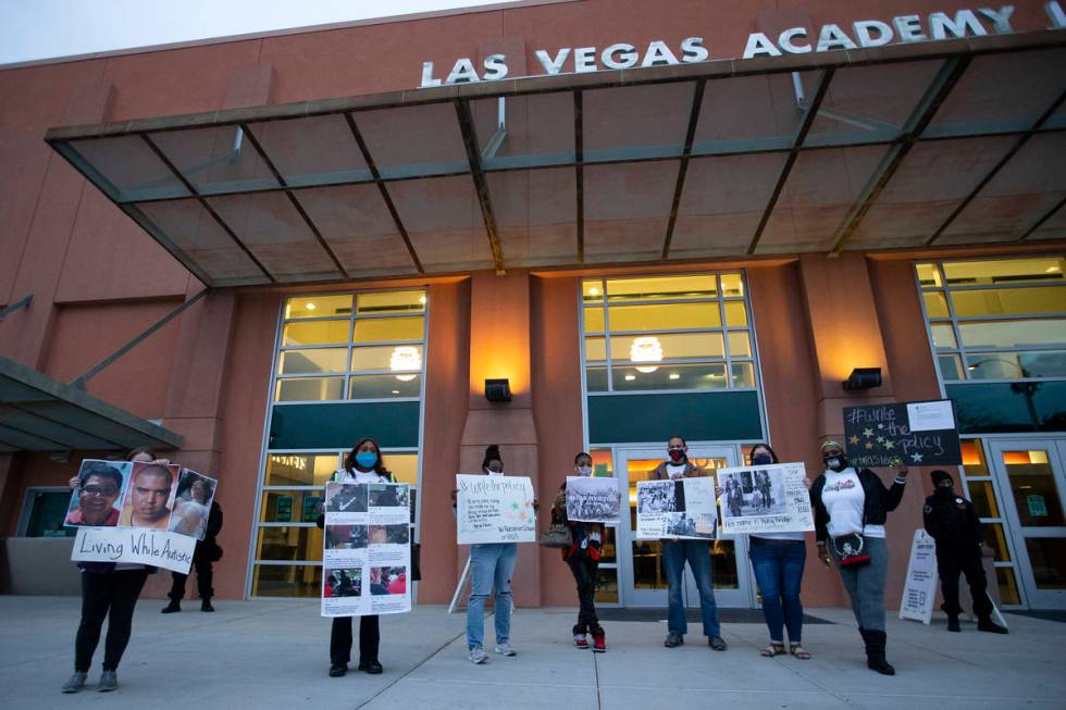 Protesters with No Racism in Schools #1865 silently demonstrate during a Clark County School Di ...