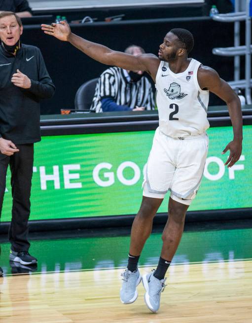 Oregon Ducks forward Eugene Omoruyi (2) celebrates a late-game score with Oregon Ducks head coa ...