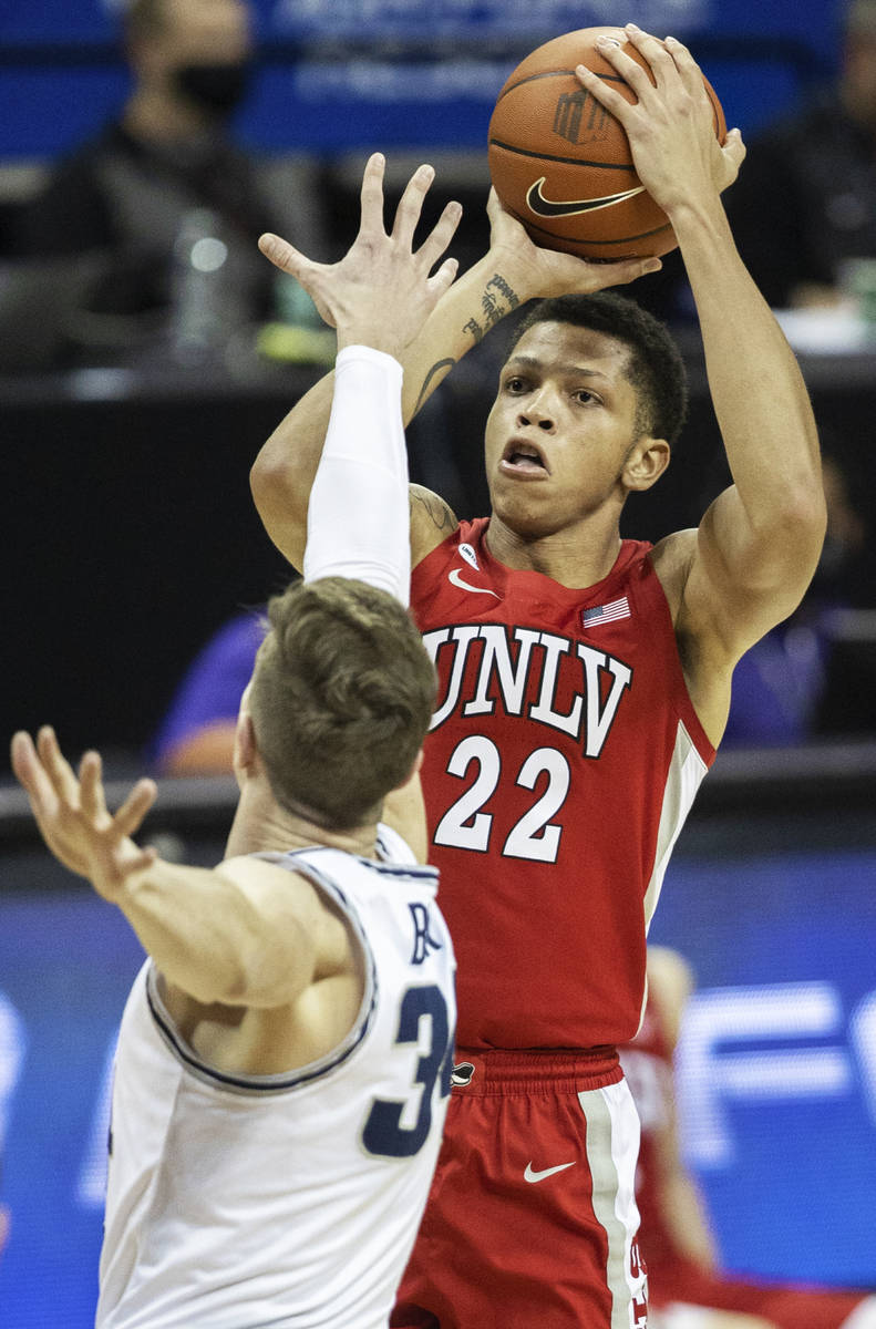 UNLV Rebels guard Nicquel Blake (22) shoots over Utah State Aggies forward Justin Bean (34) in ...