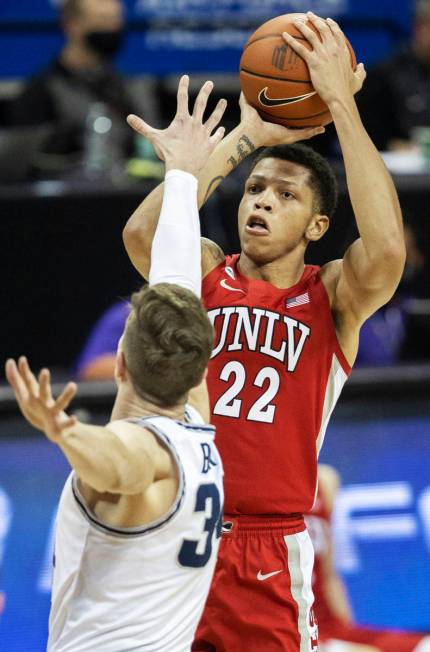 UNLV Rebels guard Nicquel Blake (22) shoots over Utah State Aggies forward Justin Bean (34) in ...