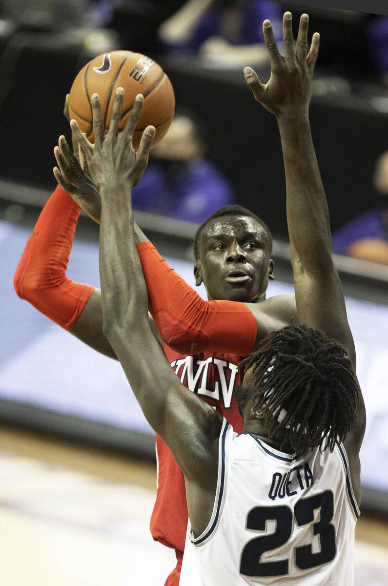 UNLV Rebels forward Cheikh Mbacke Diong (34) shoots over Utah State Aggies center Neemias Queta ...