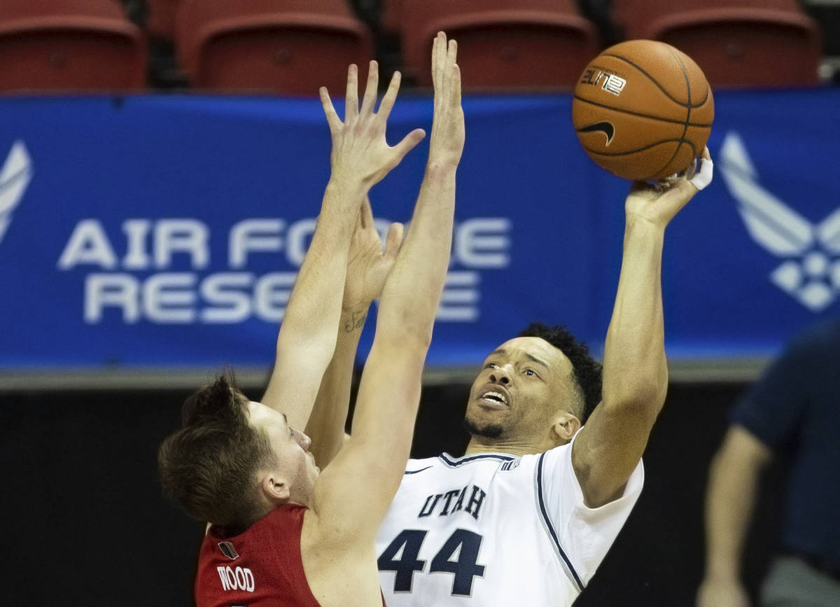 Utah State Aggies guard Marco Anthony (44) shoots over UNLV Rebels forward Moses Wood (1) in th ...