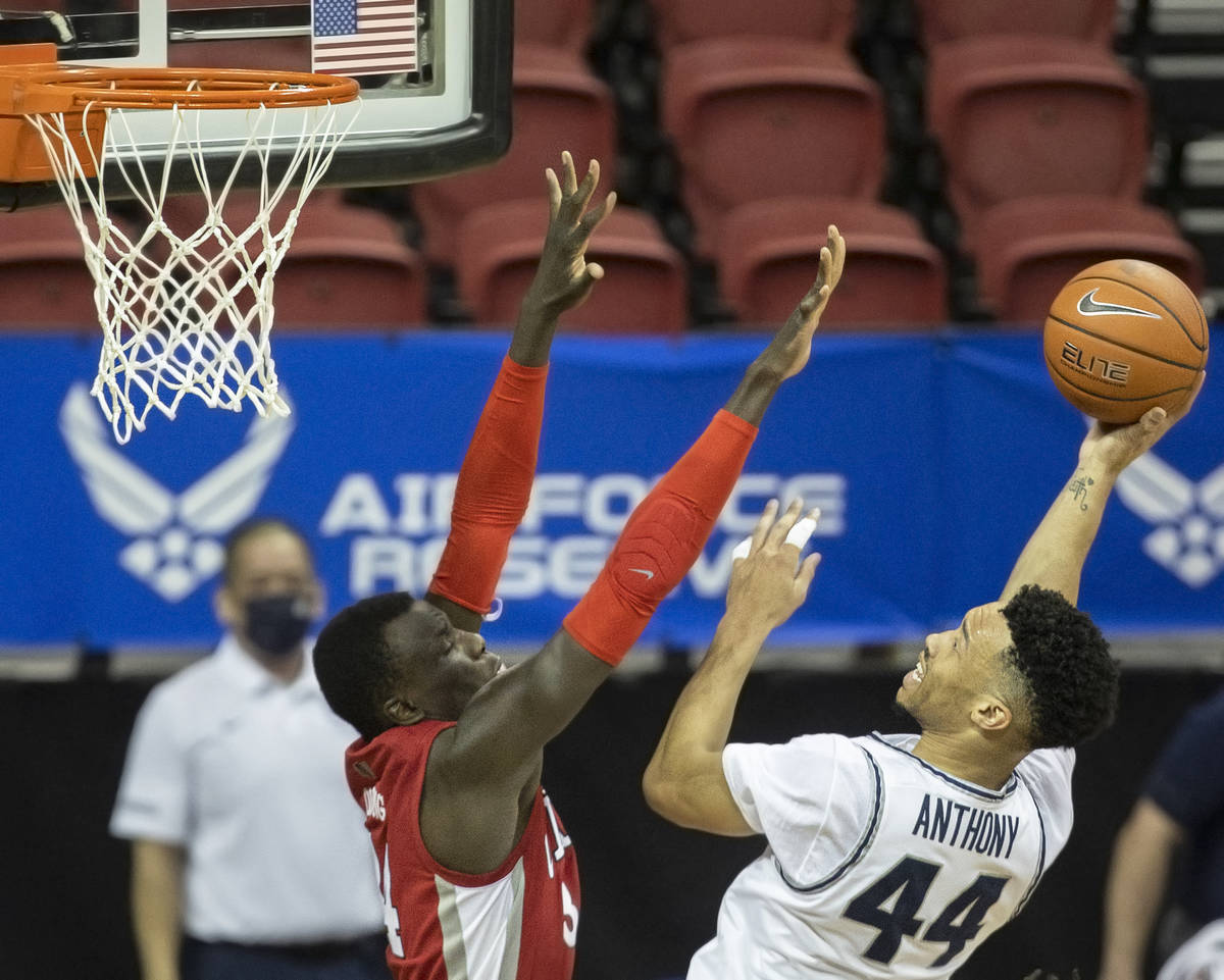 Utah State Aggies guard Marco Anthony (44) shoots over UNLV Rebels forward Cheikh Mbacke Diong ...