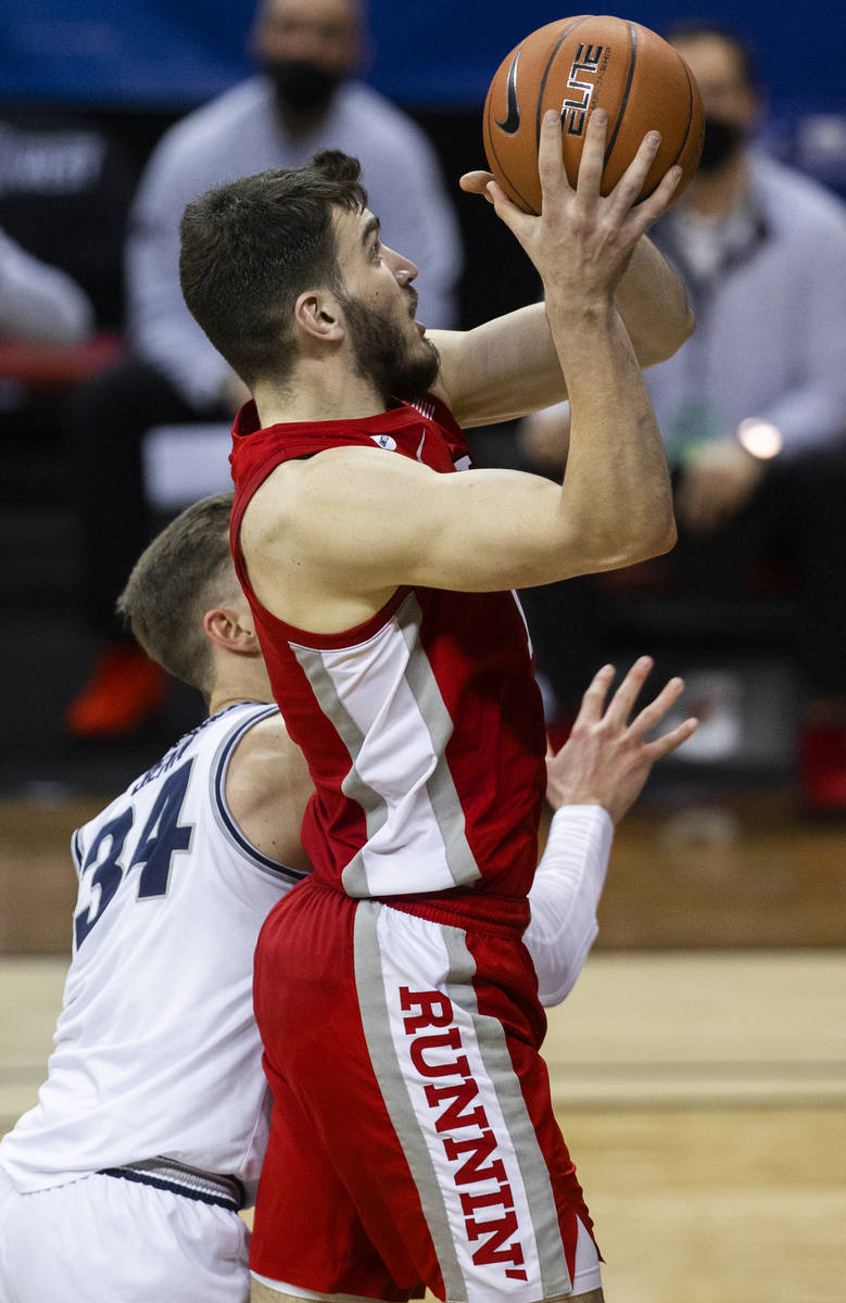 UNLV Rebels forward Edoardo Del Cadia (10) drives past Utah State Aggies forward Justin Bean (3 ...