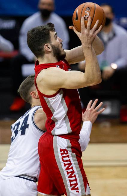 UNLV Rebels forward Edoardo Del Cadia (10) drives past Utah State Aggies forward Justin Bean (3 ...