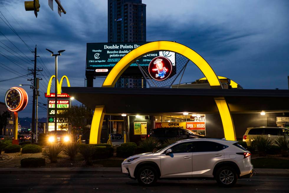 A McDonald's featuring Googie architecture as well as a neon sign of the original mascot, Speed ...