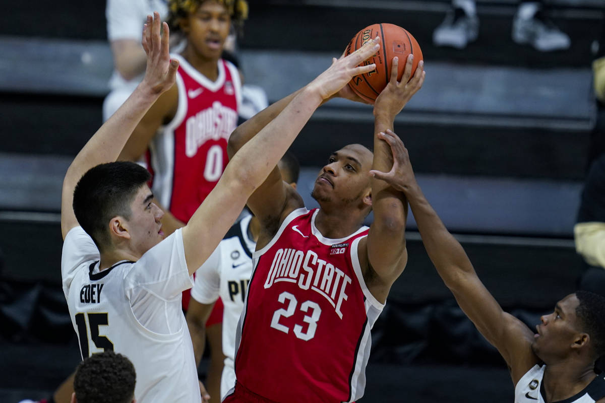 Ohio State forward Zed Key (23) shoots over Purdue center Zach Edey (15) in the first half of a ...