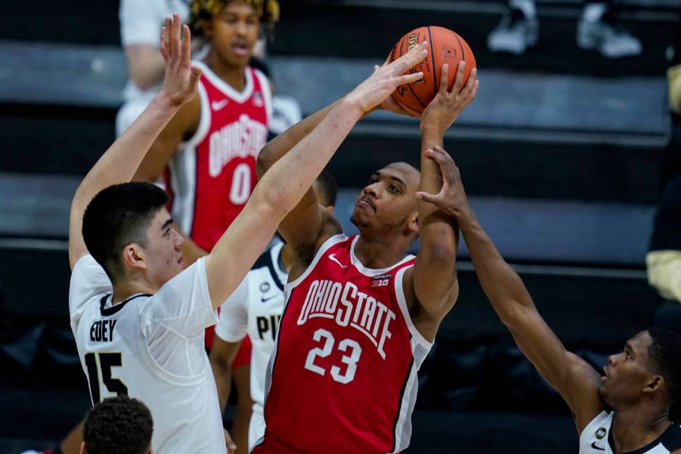 Ohio State forward Zed Key (23) shoots over Purdue center Zach Edey (15) in the first half of a ...