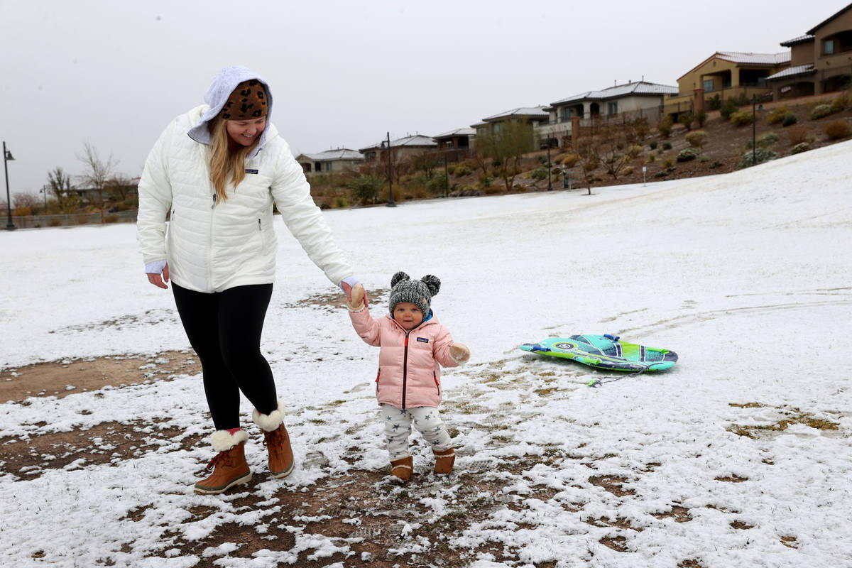Collins Morris, 1, of Las Vegas, takes a walk with mother Valerin Morris looks on at Fox Hill P ...