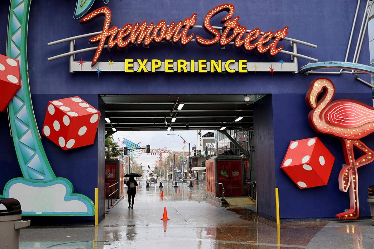 A light rain falls at the Fremont Street Experience in downtown Las Vegas Friday, March 12, 202 ...