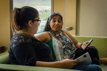 Alejandra Carrillo-Marroquin, right, a psychology student at Nevada State College, talks with a ...