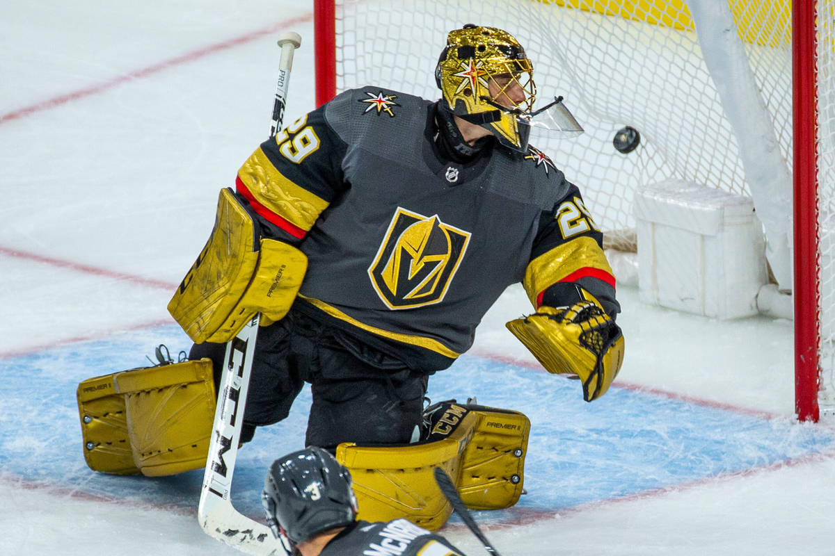 The puck gets past Vegas Golden Knights goaltender Marc-Andre Fleury (29) for the Washington Ca ...