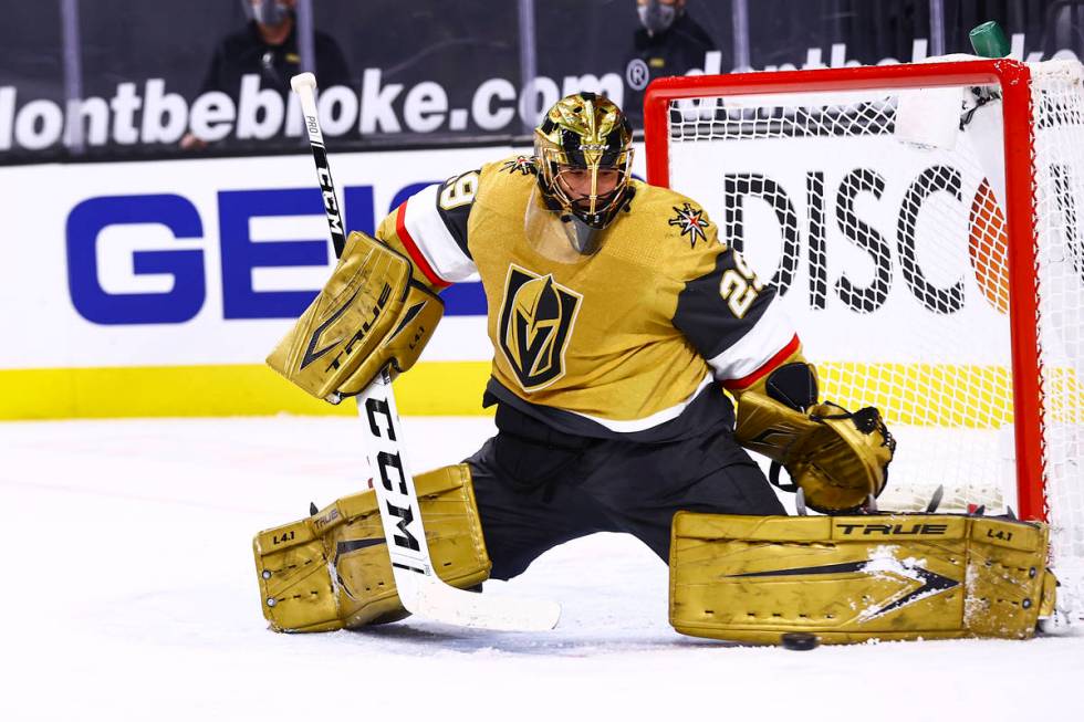 Golden Knights goaltender Marc-Andre Fleury (29) blocks the puck during the first period of an ...