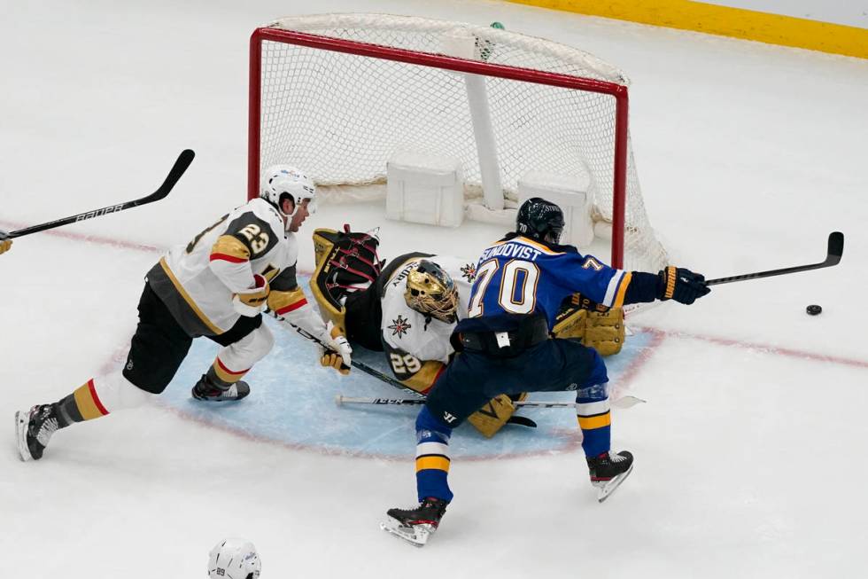 St. Louis Blues' Oskar Sundqvist reaches for a loose puck as Vegas Golden Knights goaltender Ma ...